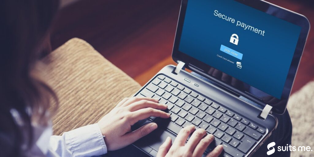 A lady making a secure payment online using her safe debit card